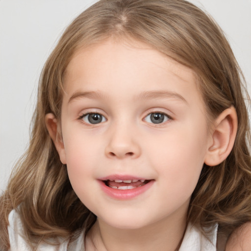 Joyful white child female with medium  brown hair and grey eyes