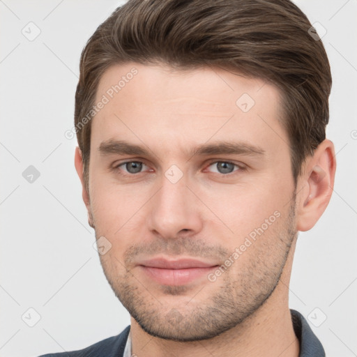 Joyful white young-adult male with short  brown hair and grey eyes