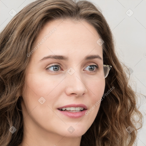 Joyful white young-adult female with long  brown hair and blue eyes