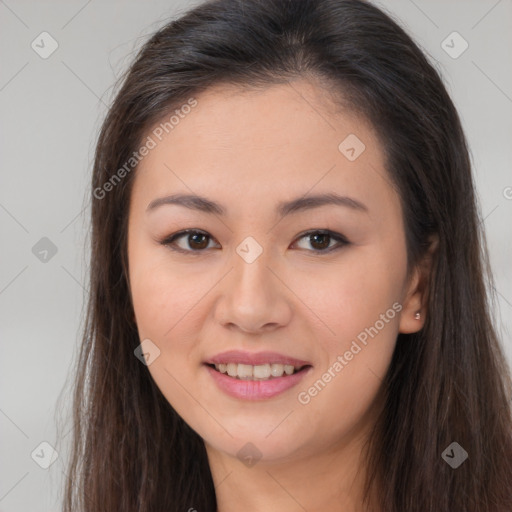 Joyful asian young-adult female with long  brown hair and brown eyes