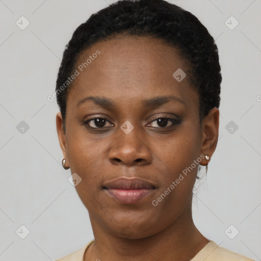 Joyful black young-adult female with short  black hair and brown eyes