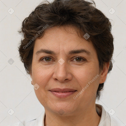 Joyful white adult female with short  brown hair and brown eyes