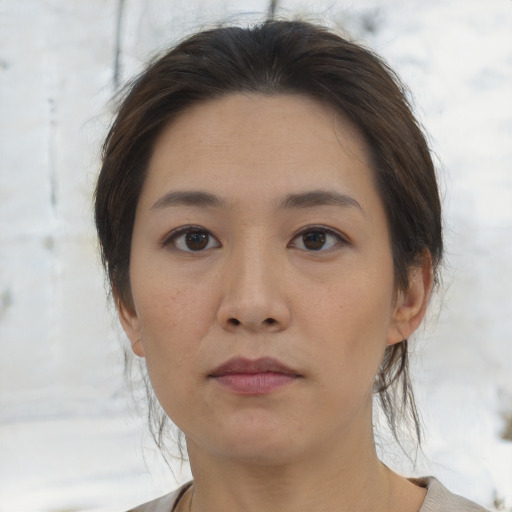 Neutral asian young-adult female with medium  brown hair and brown eyes