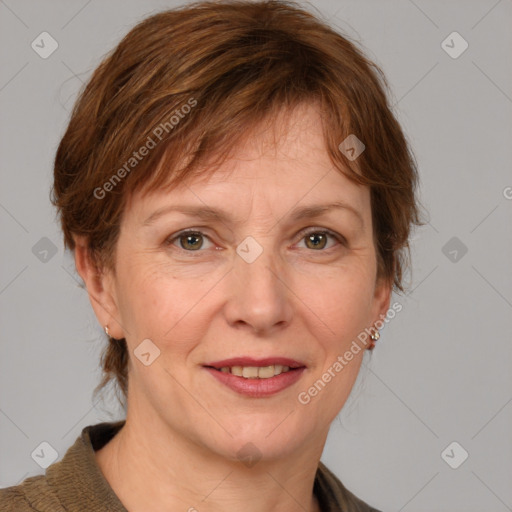 Joyful white adult female with medium  brown hair and grey eyes