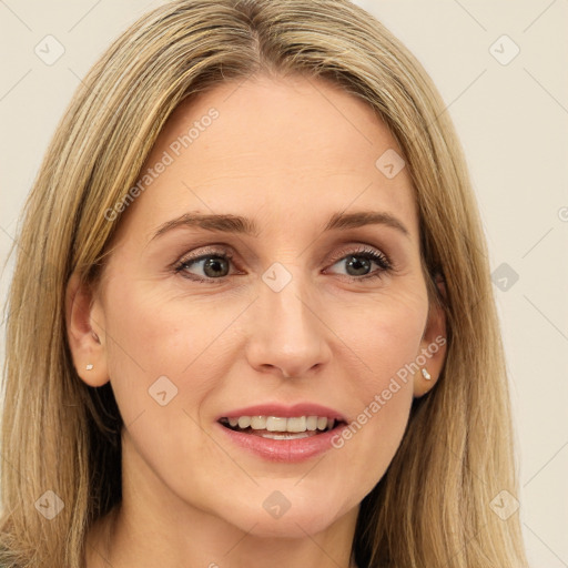 Joyful white young-adult female with long  brown hair and green eyes