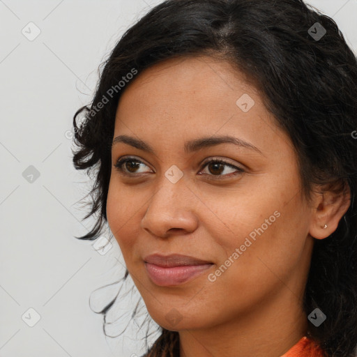 Joyful latino young-adult female with long  brown hair and brown eyes