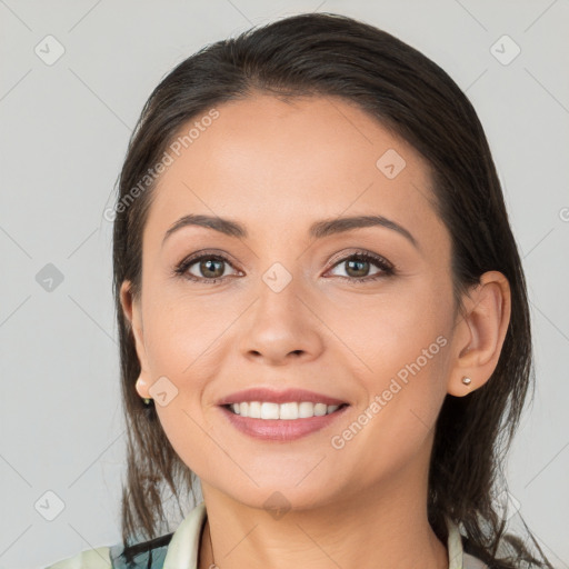 Joyful white young-adult female with medium  brown hair and brown eyes