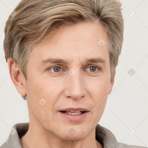 Joyful white adult male with short  brown hair and grey eyes