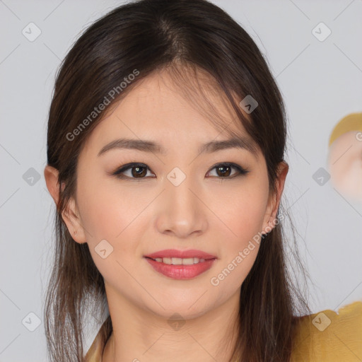 Joyful asian young-adult female with long  brown hair and brown eyes