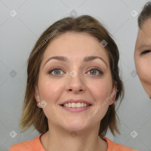 Joyful white young-adult female with medium  brown hair and grey eyes