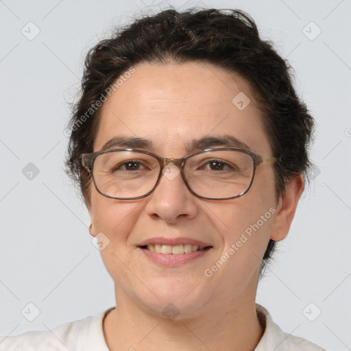 Joyful white adult female with short  brown hair and brown eyes