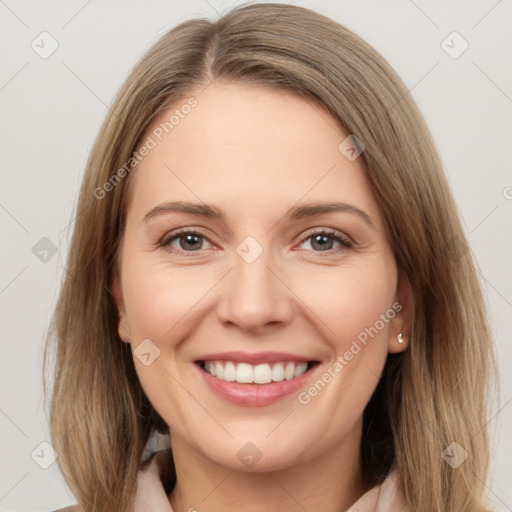 Joyful white young-adult female with long  brown hair and brown eyes