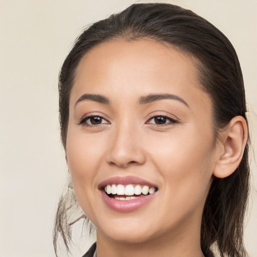 Joyful white young-adult female with medium  brown hair and brown eyes