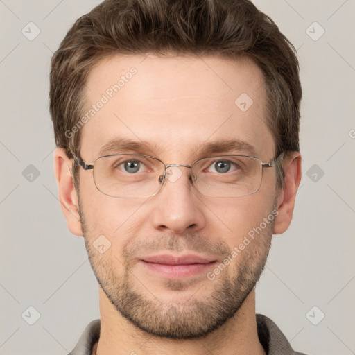 Joyful white adult male with short  brown hair and grey eyes