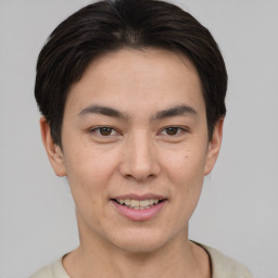 Joyful asian young-adult male with short  brown hair and brown eyes