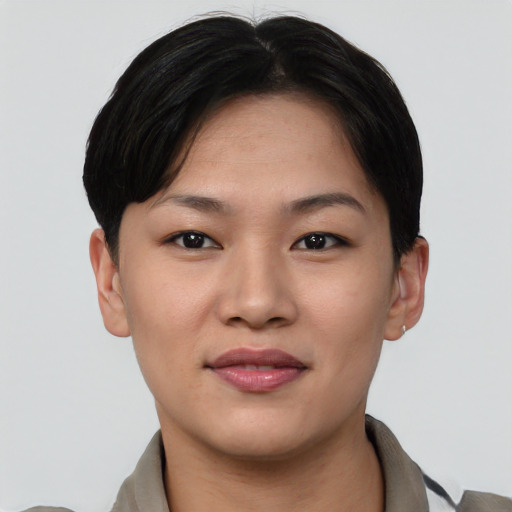 Joyful asian young-adult female with short  black hair and brown eyes
