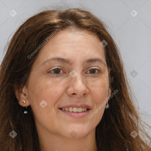 Joyful white adult female with long  brown hair and brown eyes