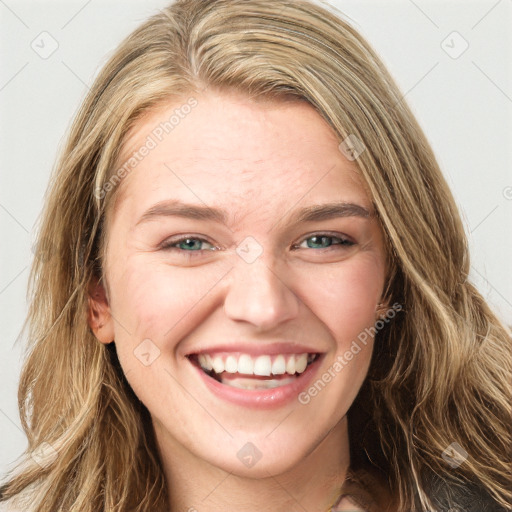 Joyful white young-adult female with long  brown hair and green eyes