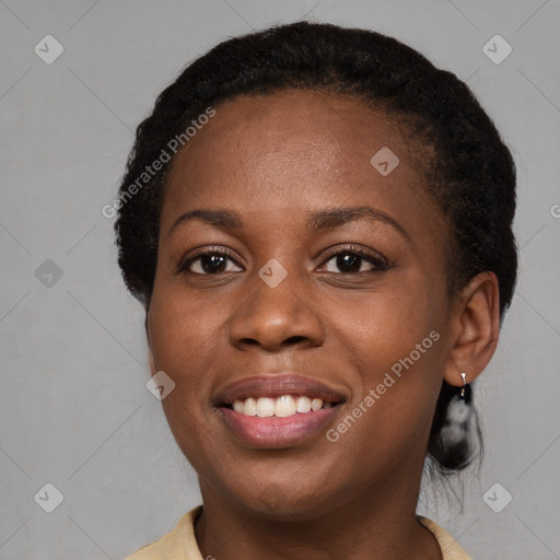 Joyful black young-adult female with medium  black hair and brown eyes