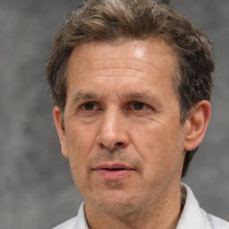 Neutral white middle-aged male with short  brown hair and brown eyes