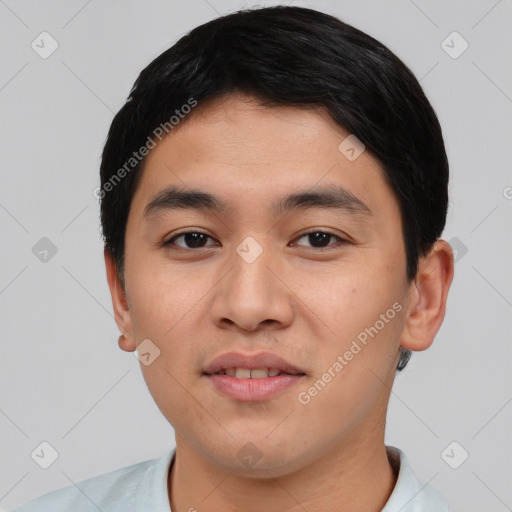Joyful asian young-adult male with short  black hair and brown eyes