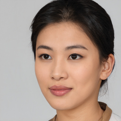 Neutral asian young-adult female with medium  brown hair and brown eyes