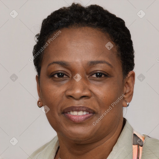 Joyful black adult female with short  brown hair and brown eyes