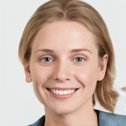 Joyful white young-adult female with medium  brown hair and blue eyes