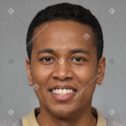 Joyful black young-adult male with short  black hair and brown eyes