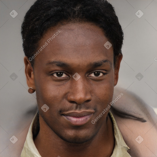 Joyful black young-adult male with short  brown hair and brown eyes