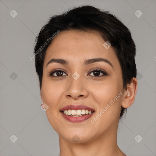 Joyful latino young-adult female with short  brown hair and brown eyes