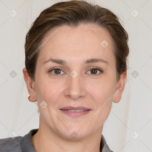 Joyful white adult female with short  brown hair and grey eyes