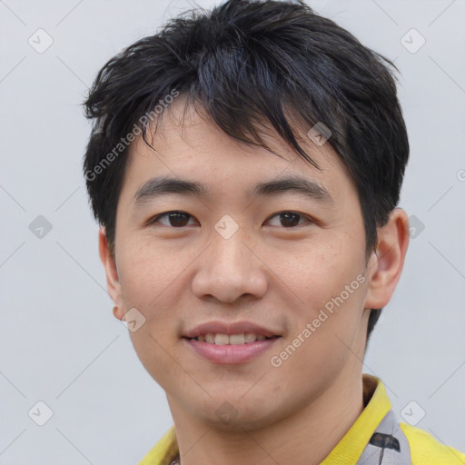 Joyful asian young-adult male with short  black hair and brown eyes