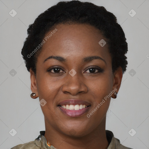 Joyful black young-adult female with short  black hair and brown eyes