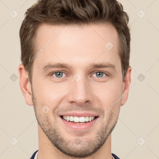 Joyful white young-adult male with short  brown hair and grey eyes