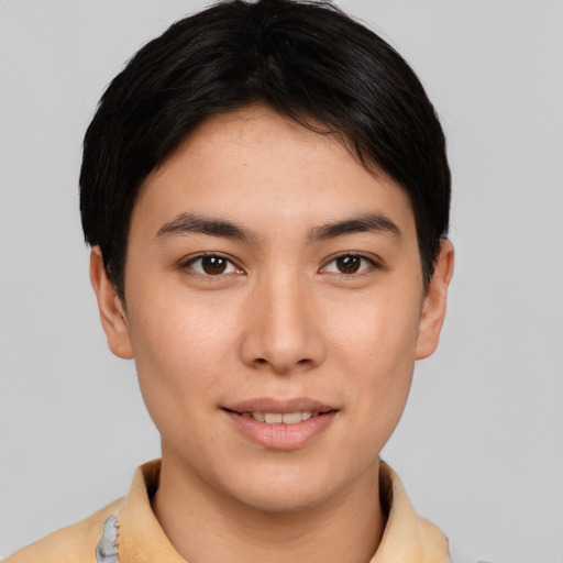 Joyful asian young-adult male with short  brown hair and brown eyes