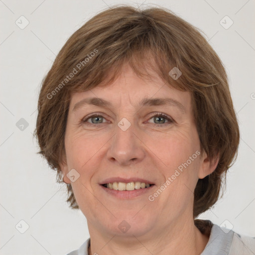 Joyful white adult female with medium  brown hair and grey eyes