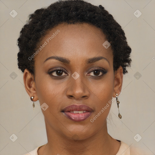 Joyful black young-adult female with short  brown hair and brown eyes