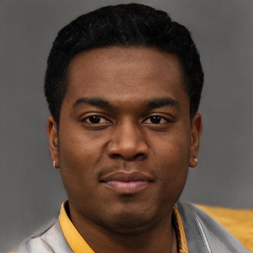 Joyful black young-adult male with short  black hair and brown eyes