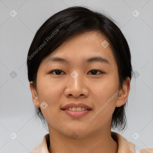 Joyful asian young-adult female with medium  black hair and brown eyes