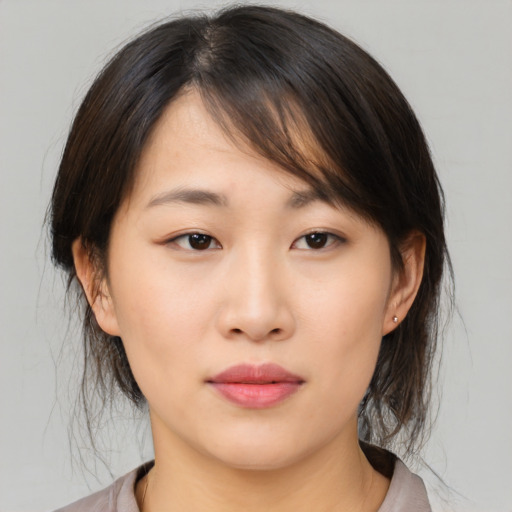 Neutral asian young-adult female with medium  brown hair and brown eyes
