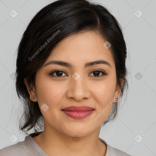 Joyful latino young-adult female with medium  brown hair and brown eyes