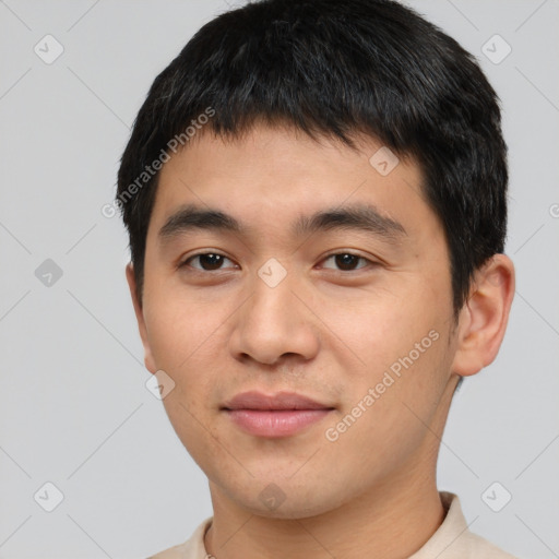 Joyful white young-adult male with short  black hair and brown eyes