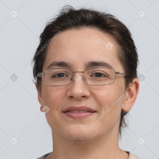 Joyful white adult female with short  brown hair and brown eyes