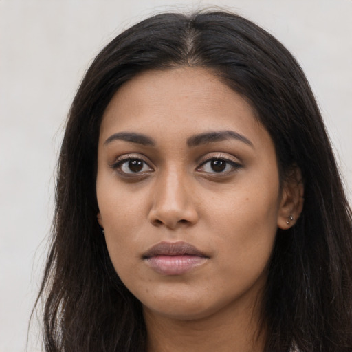 Neutral latino young-adult female with long  brown hair and brown eyes