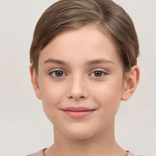 Joyful white child female with short  brown hair and brown eyes