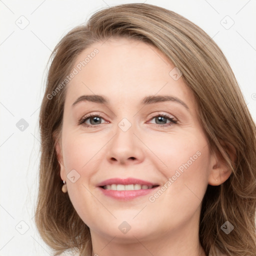 Joyful white young-adult female with long  brown hair and grey eyes