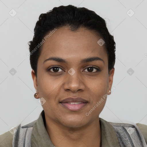 Joyful black young-adult female with short  black hair and brown eyes