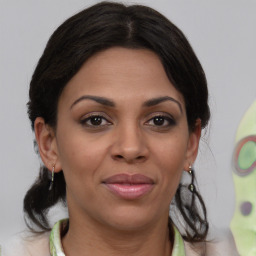 Joyful white adult female with medium  brown hair and brown eyes