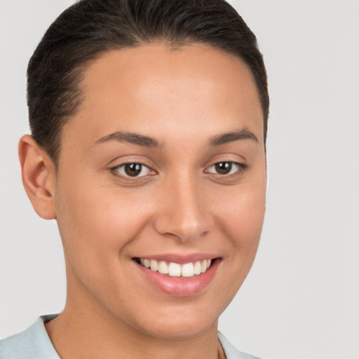 Joyful white young-adult female with short  brown hair and brown eyes